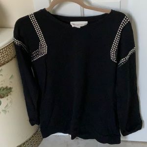 Black sweatshirt with silver studs on shoulders